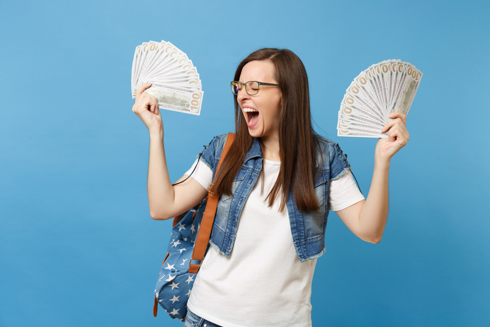 College girl showing her money