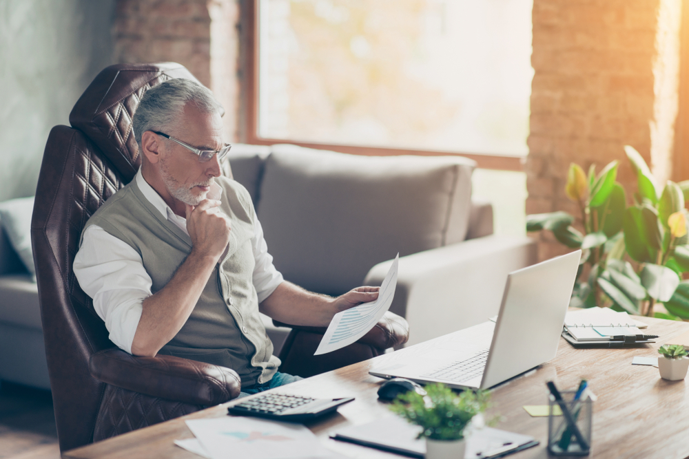 Old man watching stocks