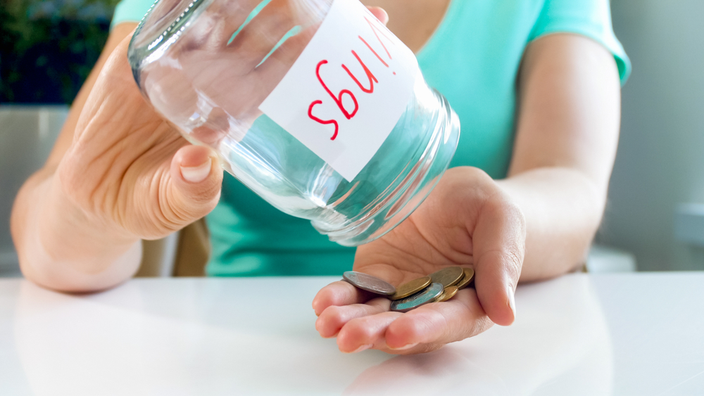 Old woman with an empty savings jar