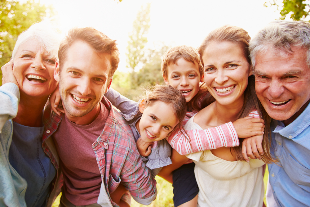 A complete family having fun outside