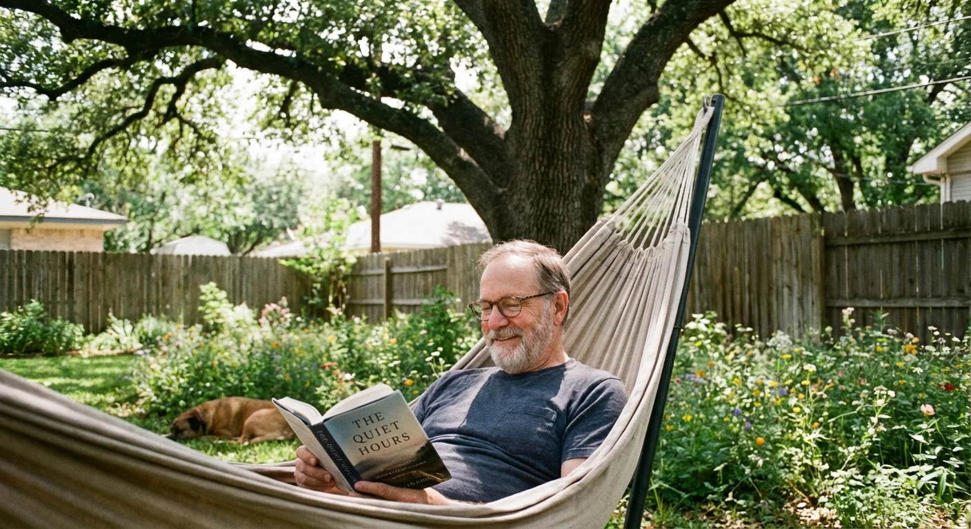 A senior man relaxing in a hammock in a quiet backyard.